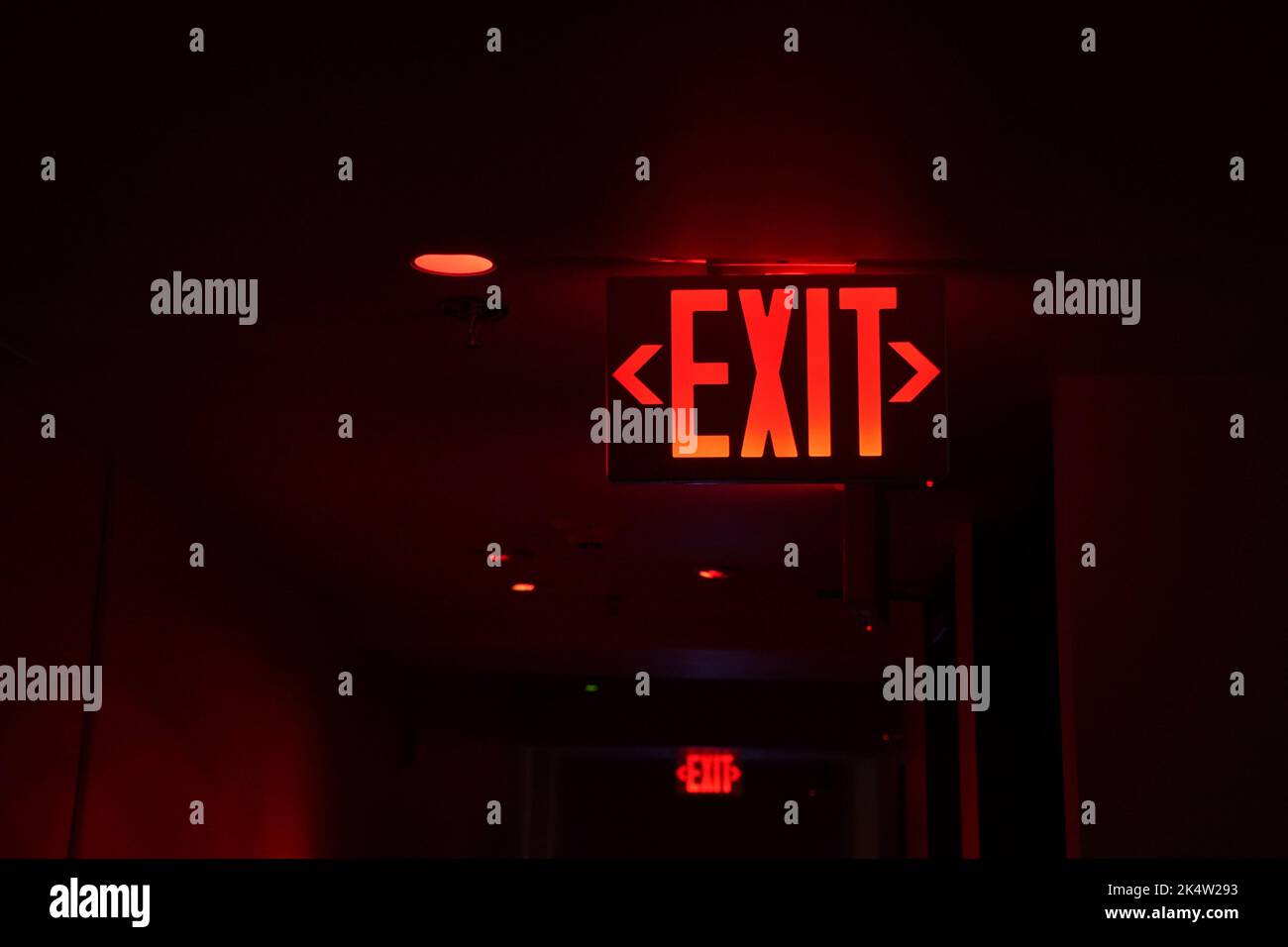exit red light sign on black background Stock Photo