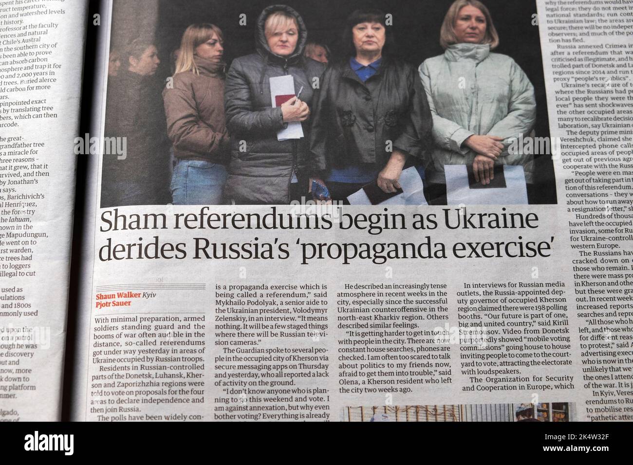 'Sham referendums begin as Ukraine derides Russia's propaganda exercise' Guardian newspaper Russia Ukraine war article clipping 24 September 2022 UK Stock Photo