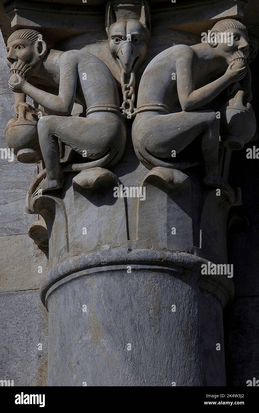 Long-tailed, semi-human demons feed on fruit, shackled at the waist ...