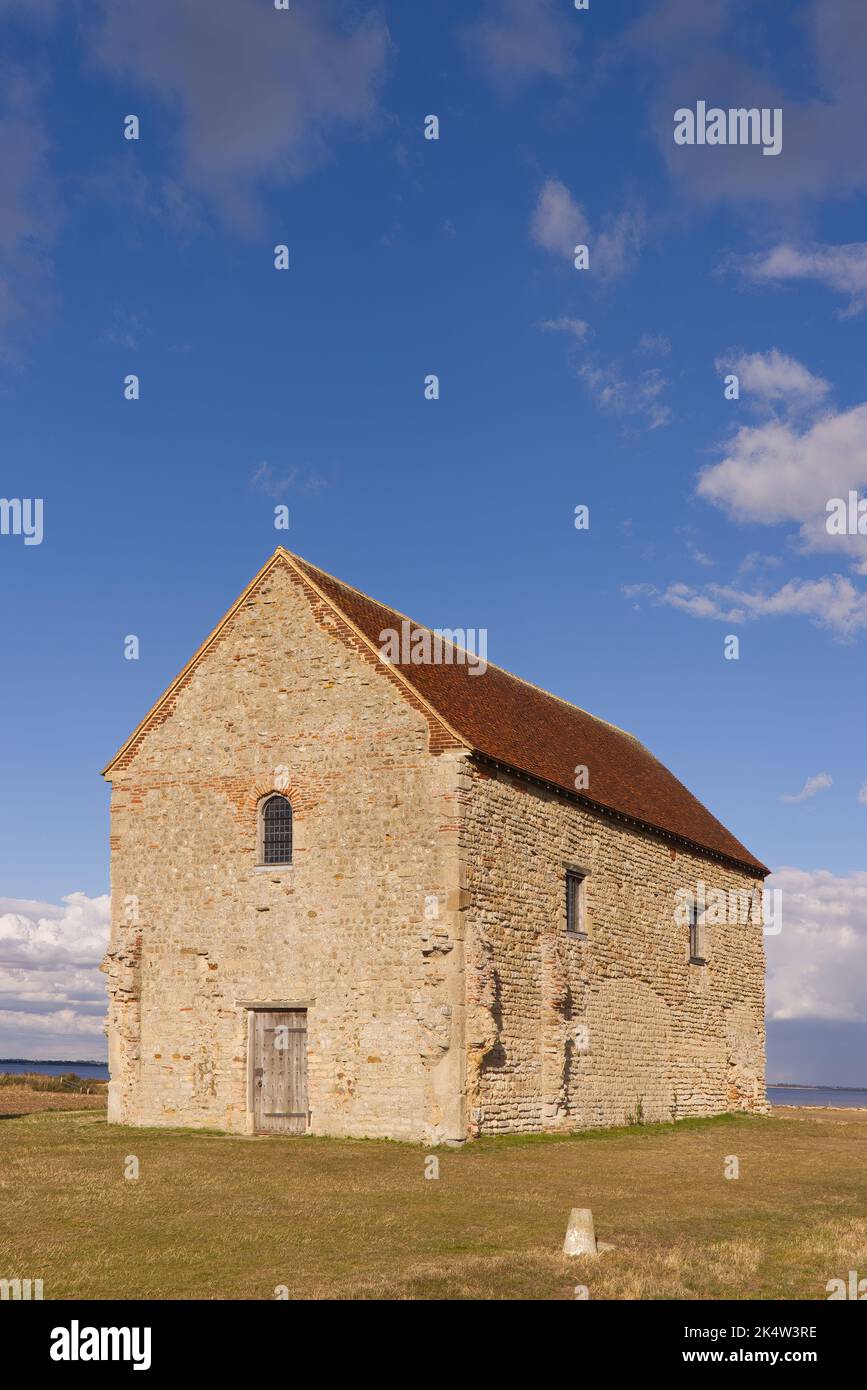 The Chapel of St Peter-on-the-Wall, Bradwell-on-Sea, Essex, UK in late afternoon sunshine Stock Photo