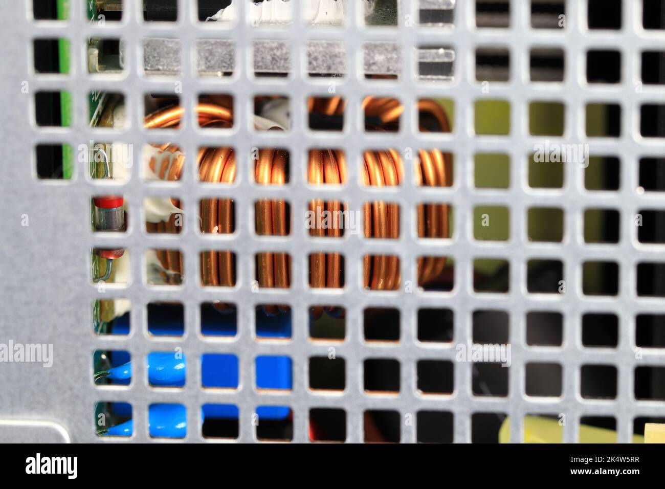 Copper coil or Inductance coil on circuit board in power supply, electronic components inside