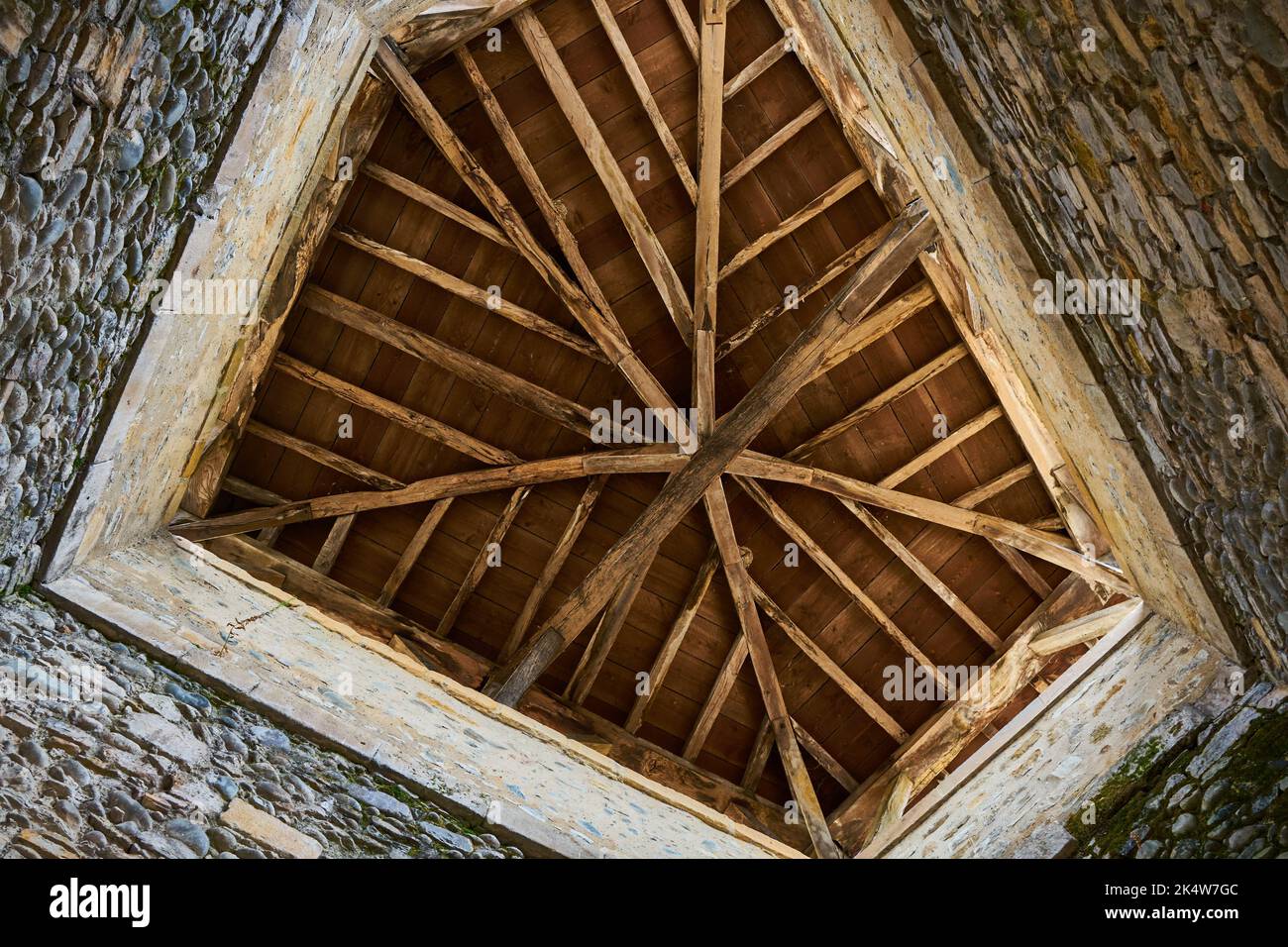 A low angle shot of a wooden hip roof Stock Photo