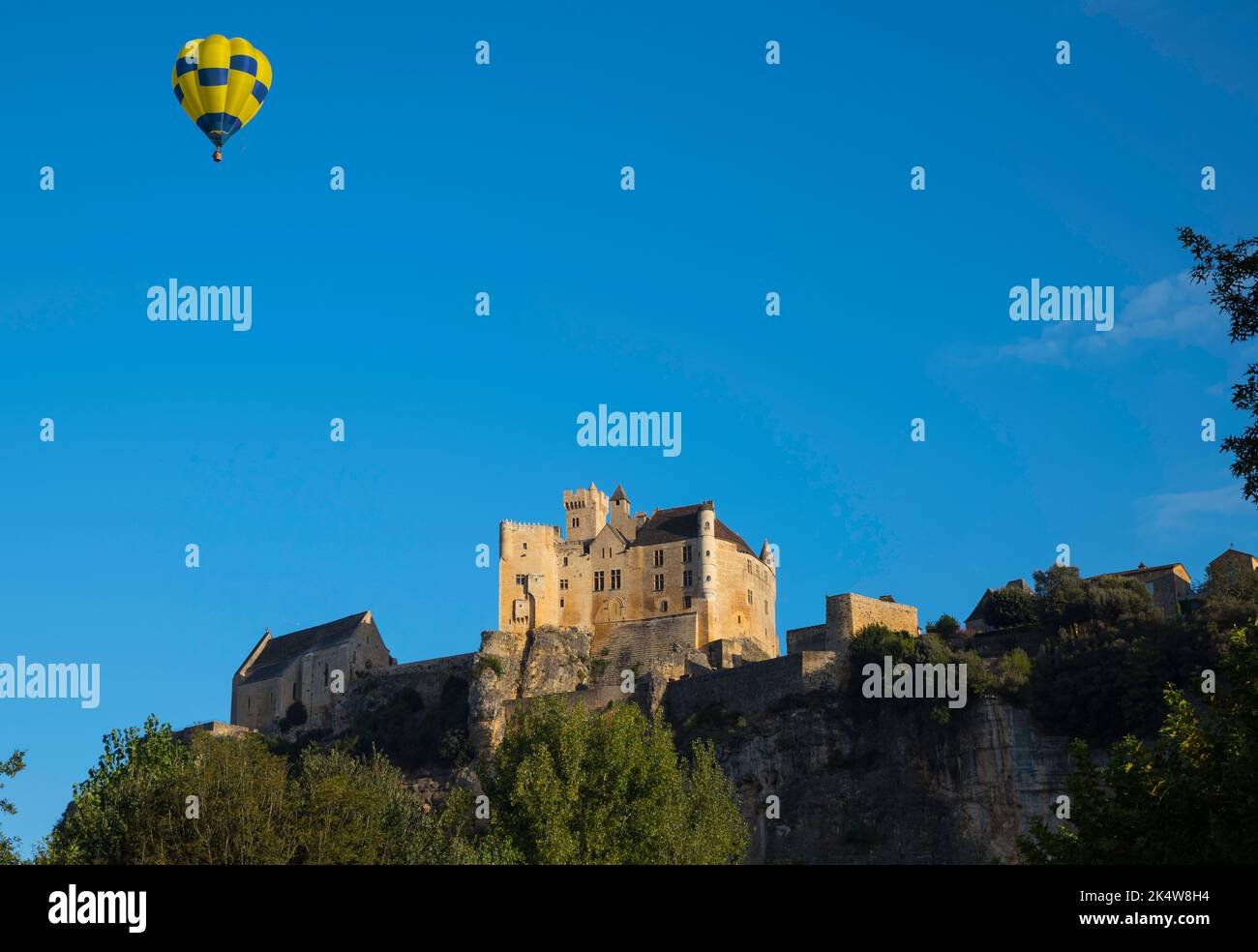 hot air balloon above the castle of Beynac in the Dordogne area in France Stock Photo