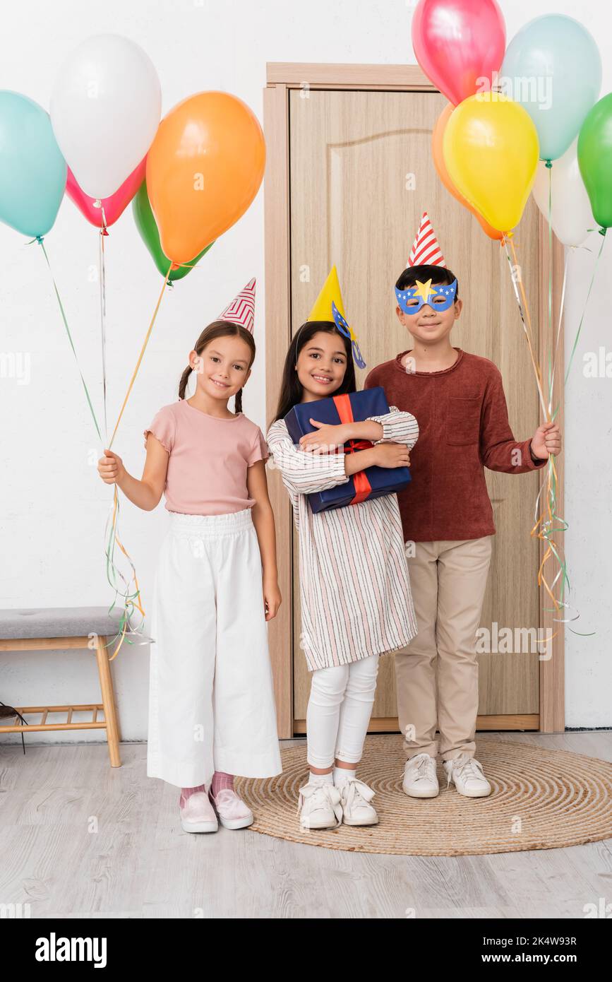 Girl friends holding balloons hi-res stock photography and images - Alamy