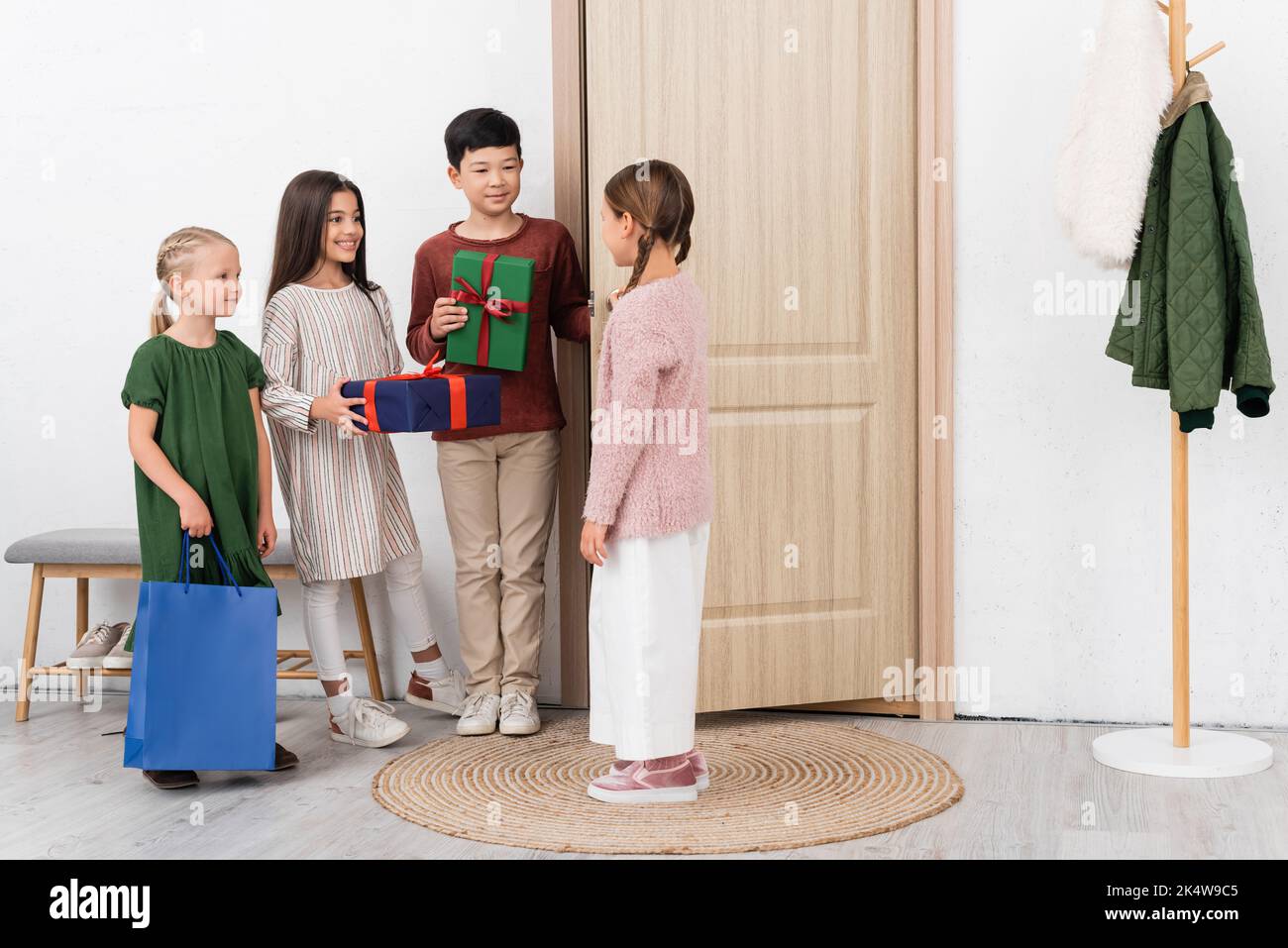 Greeting friend at door hi-res stock photography and images - Alamy