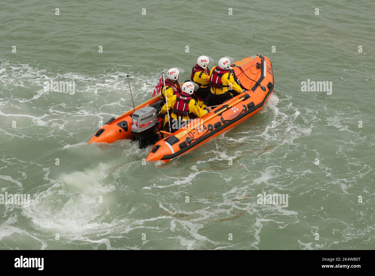 Small single engined lifeboat RIB (Rigid Inflatable Boat) with four ...