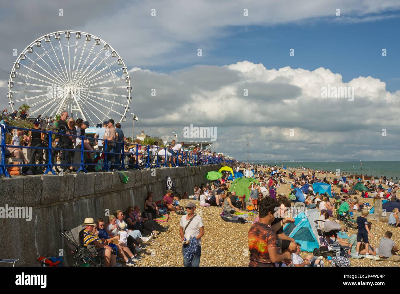 Crowds on the beach at Eastbourne in East Sussex, England. Waiting for