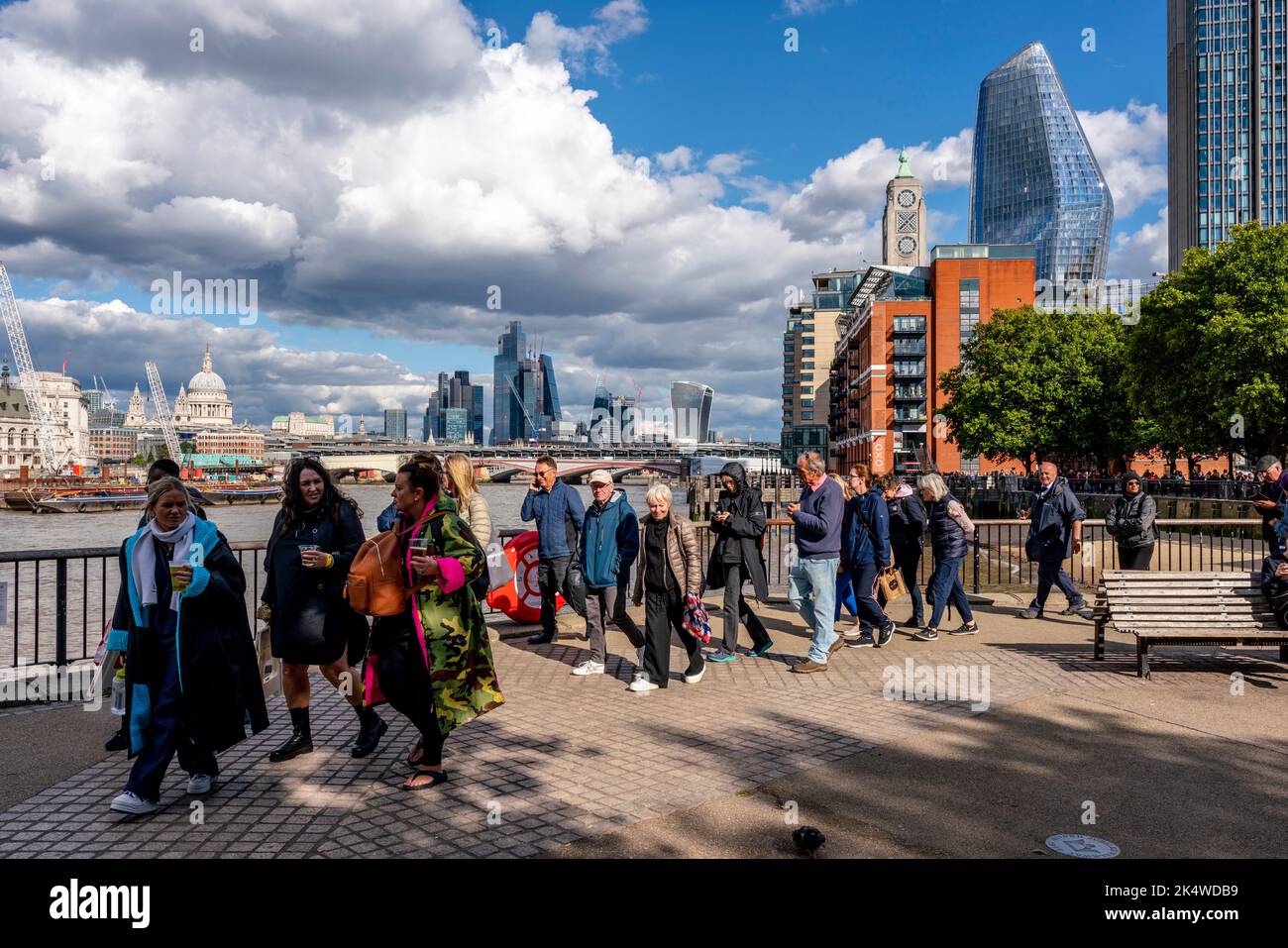 British People and People From Around The World Queue Along The ...