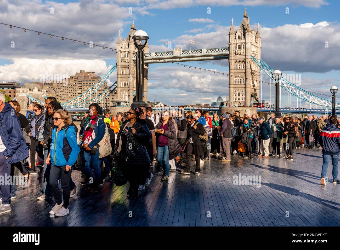 Stretching Back To Tower Bridge, British People and People From Around The World Queue To See The Queen Lying-In-State At Westminster Hall, London, UK Stock Photo