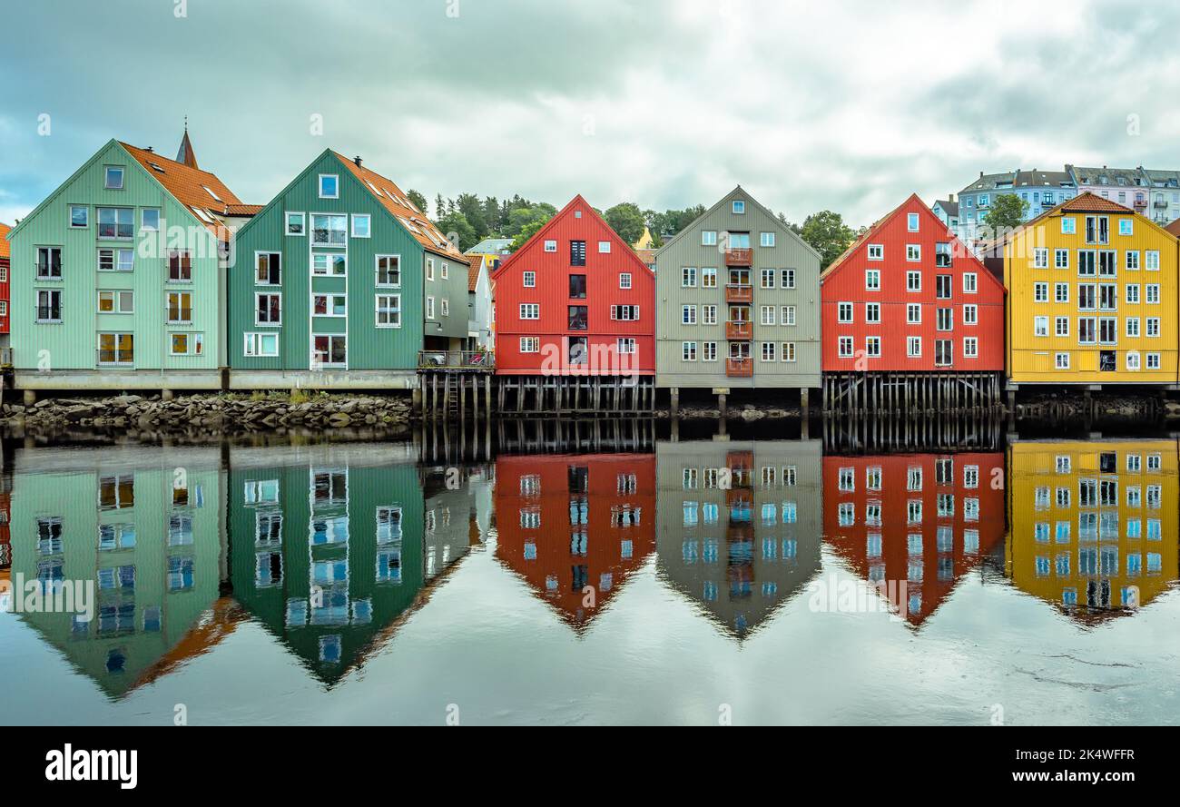The inner city's iconic waterside warehouses by the river Nidelven , one of the most distinctive historical vernacular building types in Trondheim, No Stock Photo
