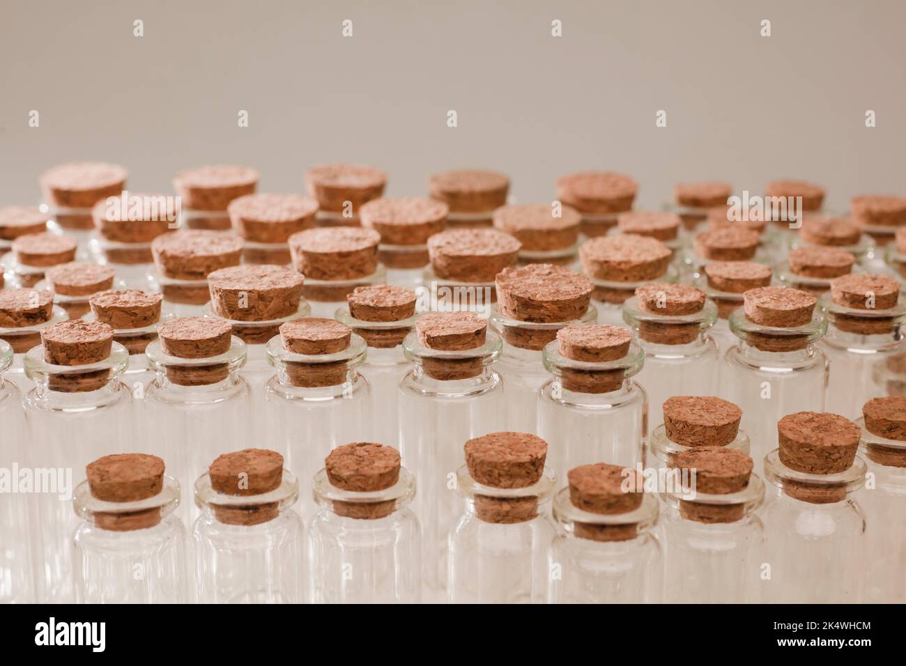 glass jars with corks, soft green background Stock Photo
