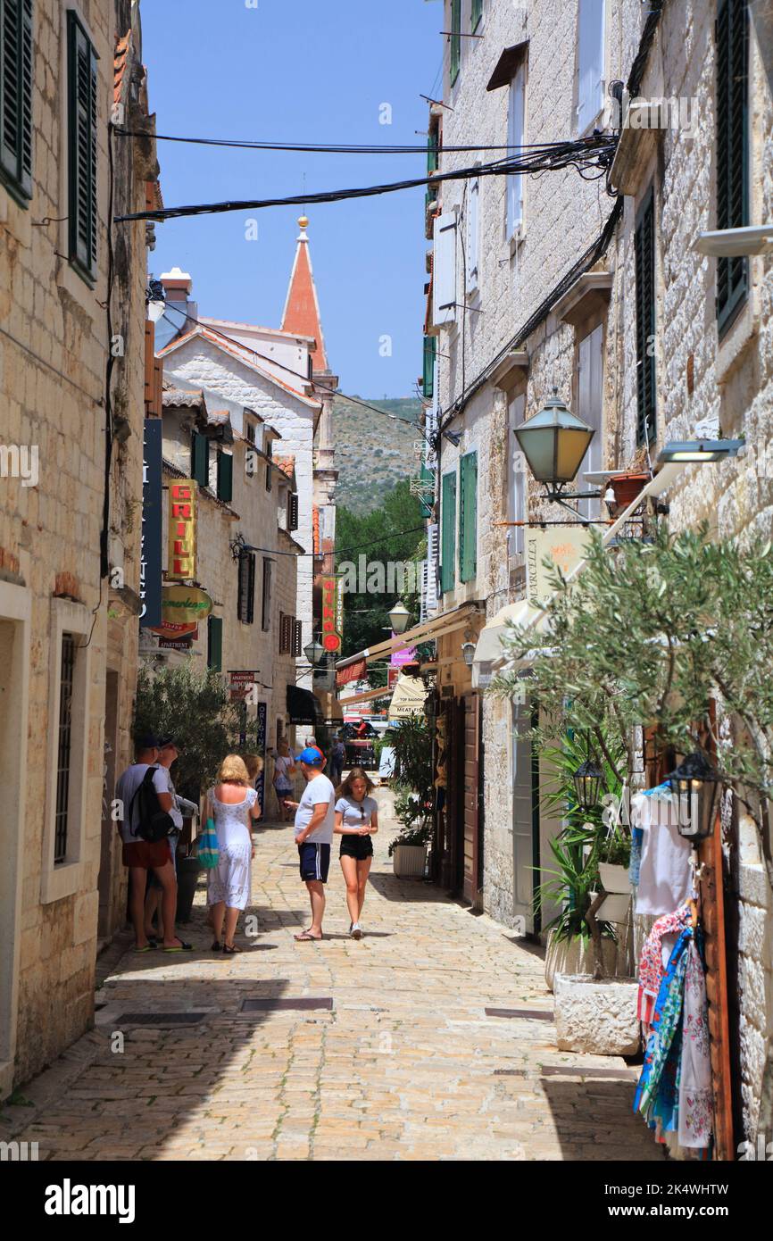 TROGIR, CROATIA - JUNE 23, 2021: Tourists visit Old Town of Trogir, Croatia. Trogir is a medieval town in Dalmatia listed as UNESCO World Heritage Sit Stock Photo