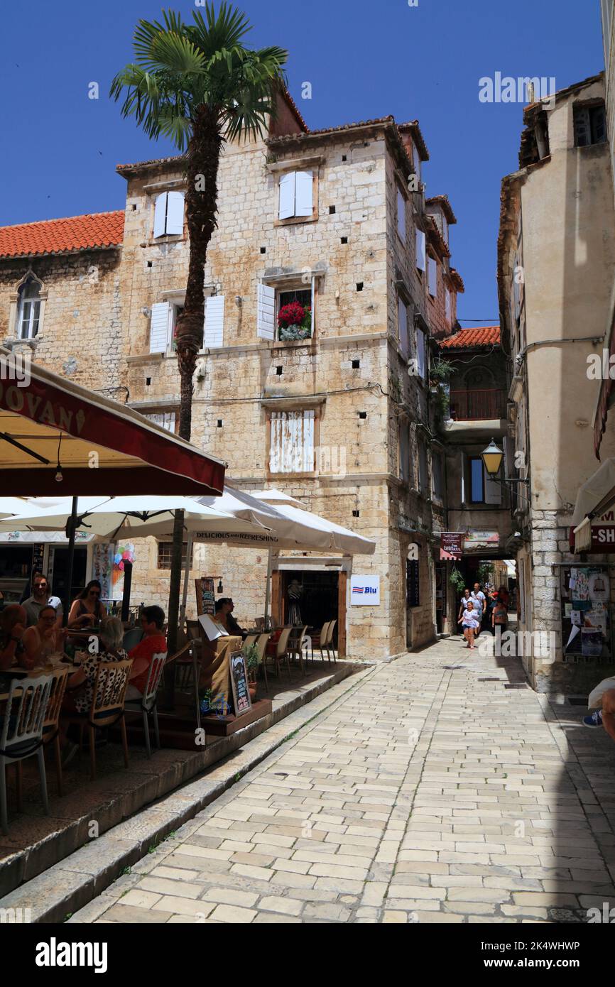 TROGIR, CROATIA - JUNE 23, 2021: Tourists visit Old Town of Trogir, Croatia. Trogir is a medieval town in Dalmatia listed as UNESCO World Heritage Sit Stock Photo