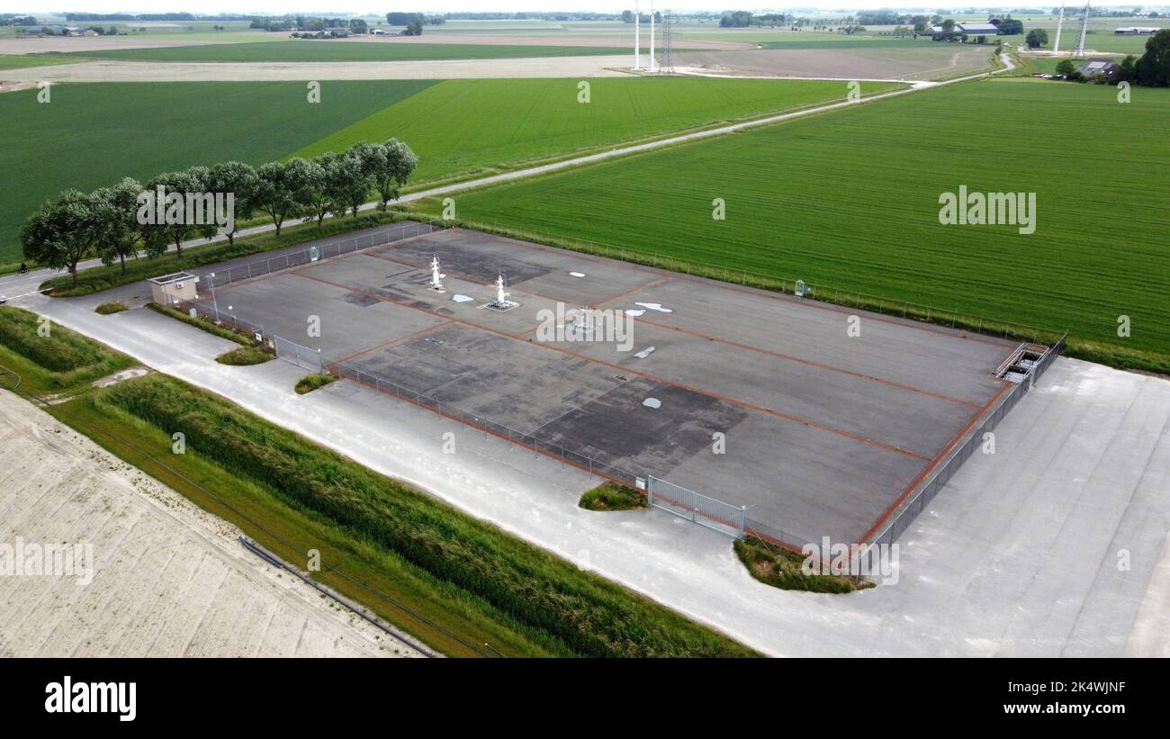 Three closed gas taps from a gas extraction location of the Groningen gas field near the village of Loppersum in the northern part of the Netherlands. Stock Photo