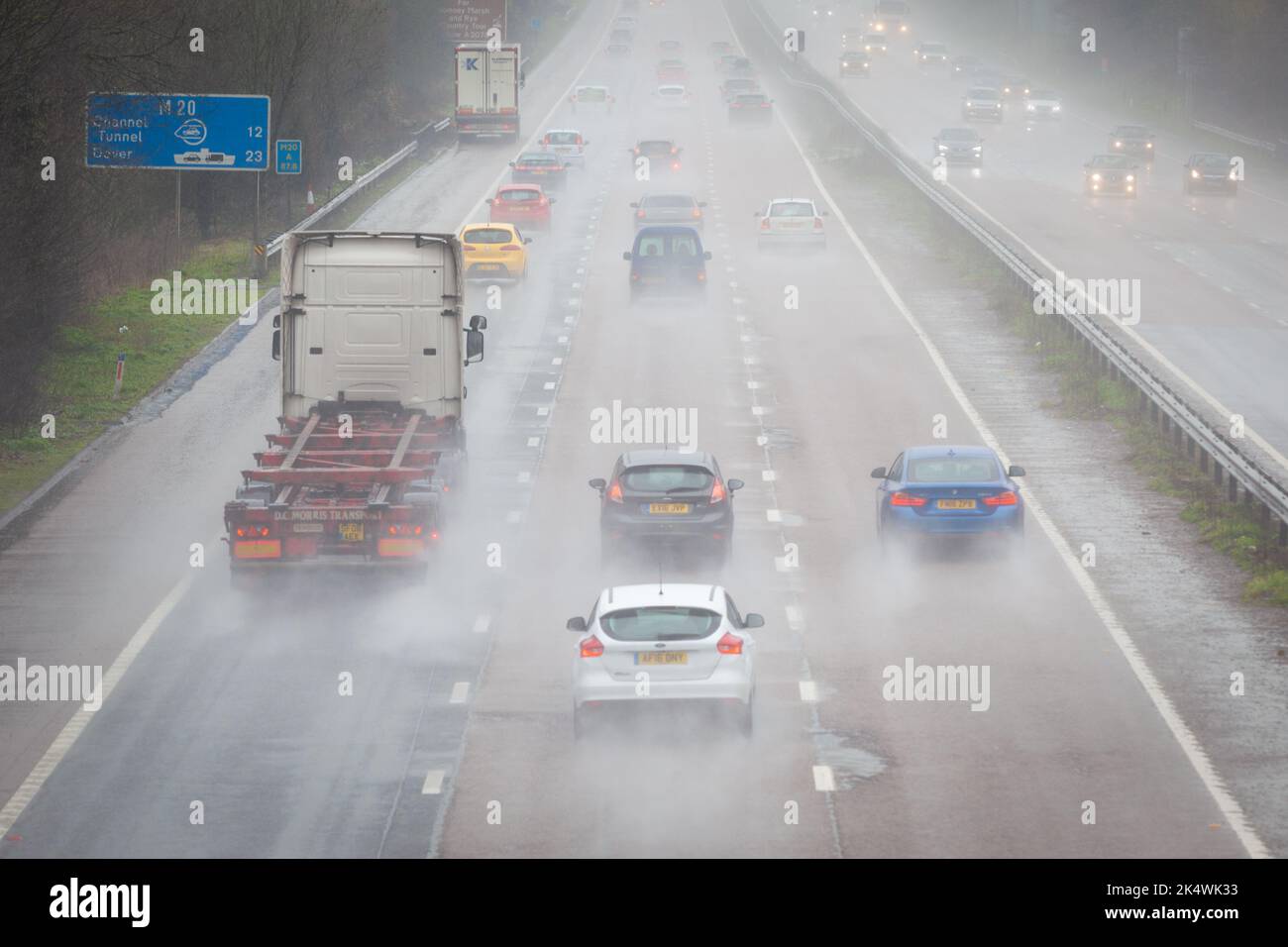 Heavy rain on the M20 motorway at Ashford is making driving conditions very difficult for motorists heading for Dover, Kent, UK Stock Photo