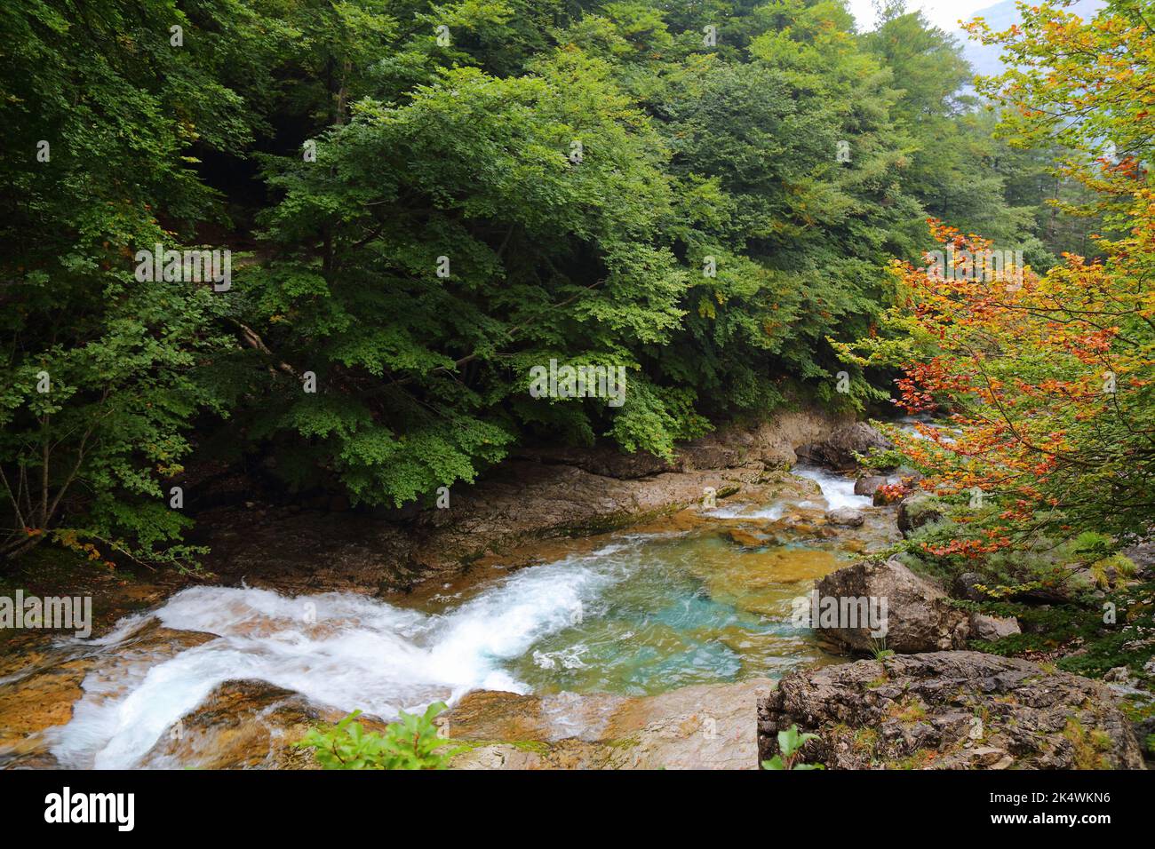 Waterfalls in mountains of Spain. Ordesa valley in Spanish Pyrenees. Autumn in Ordesa y Monte Perdido National Park. Stock Photo
