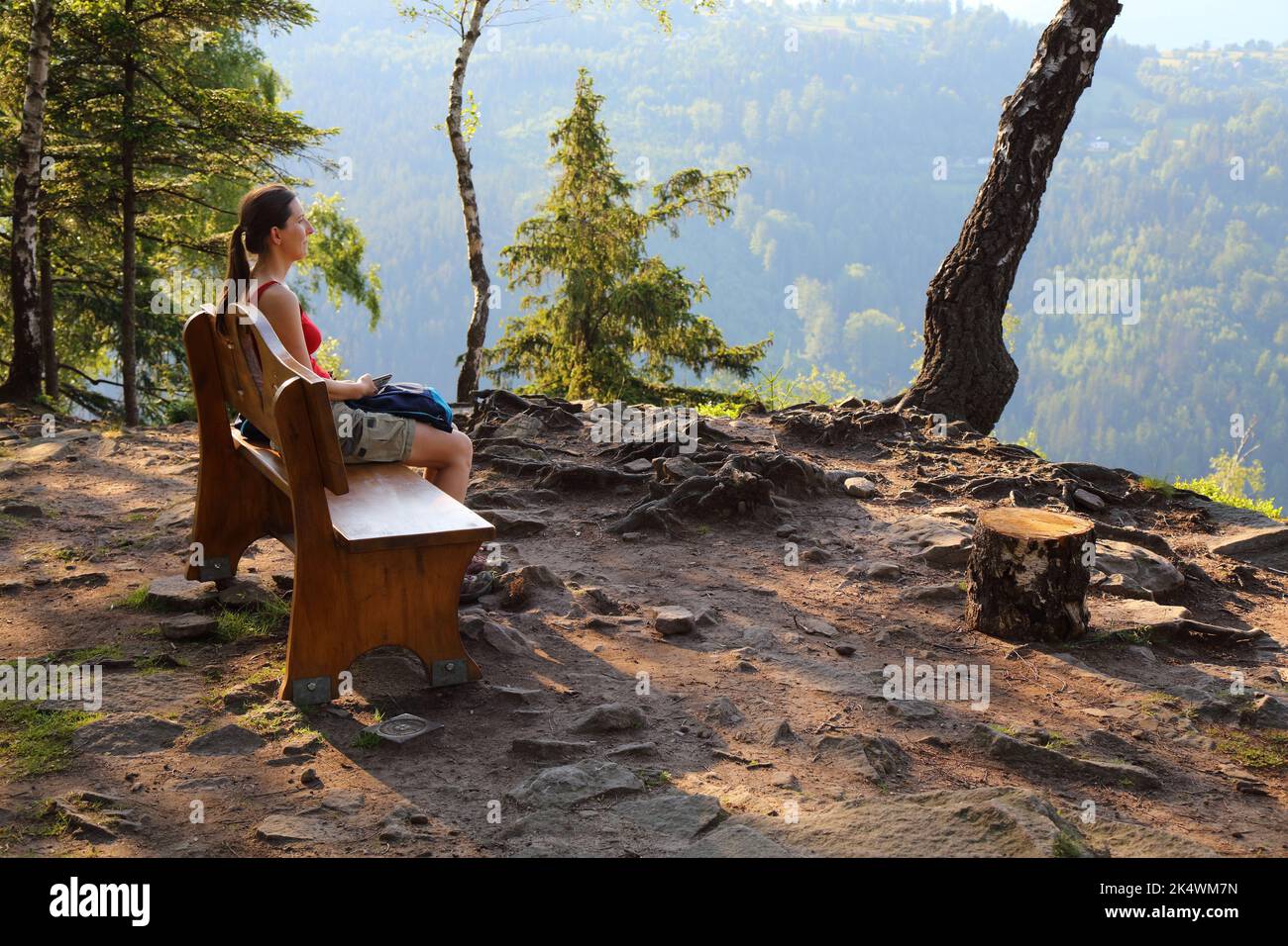 Tourist enjoys the view in Silesian Beskids, Poland. Krzakoska Skala viewpoint. Stock Photo