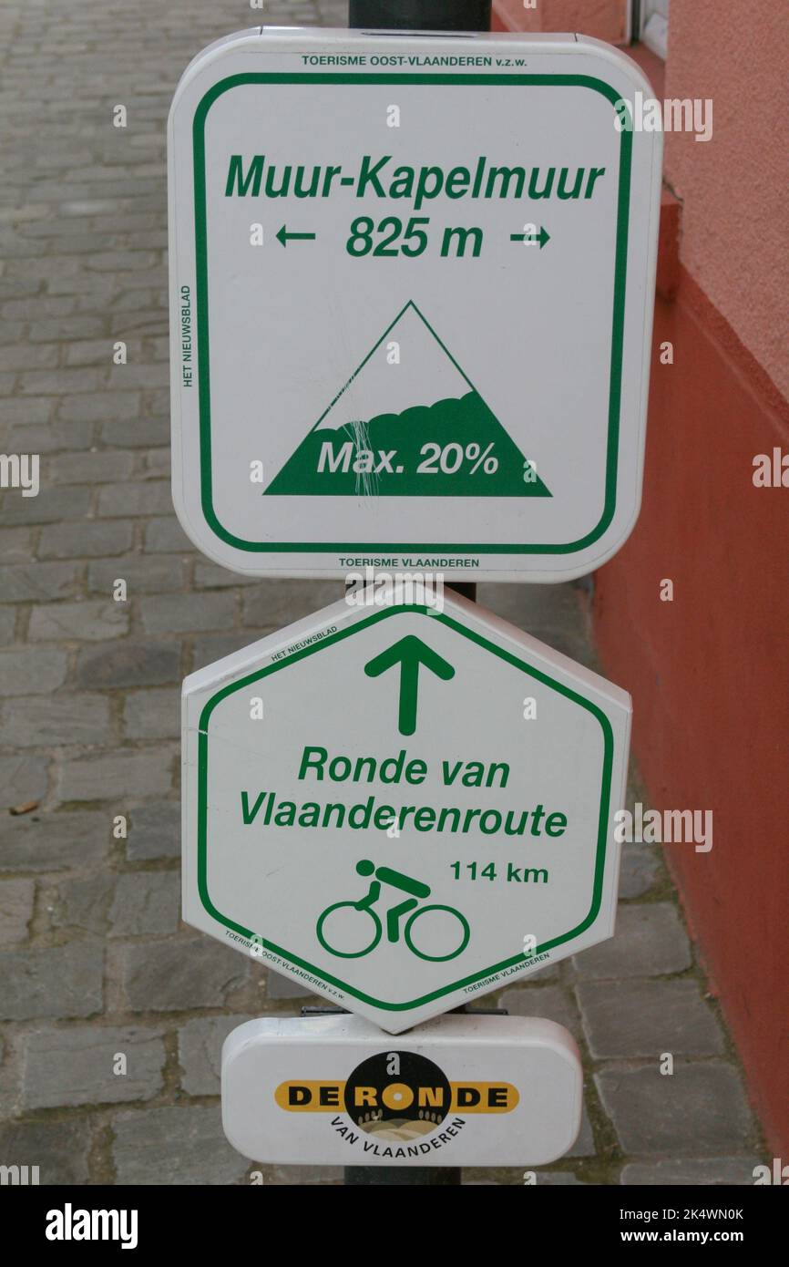 Signs mark the Muur-Kapelmuur climb and Ronde van Vlaanderen cycling ...