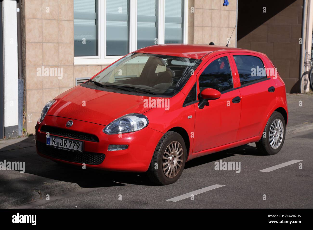 COLOGNE, GERMANY - SEPTEMBER 22, 2020: Fiat Grande Punto hatchback city car parked in Germany. There were 45.8 million cars registered in Germany (as Stock Photo