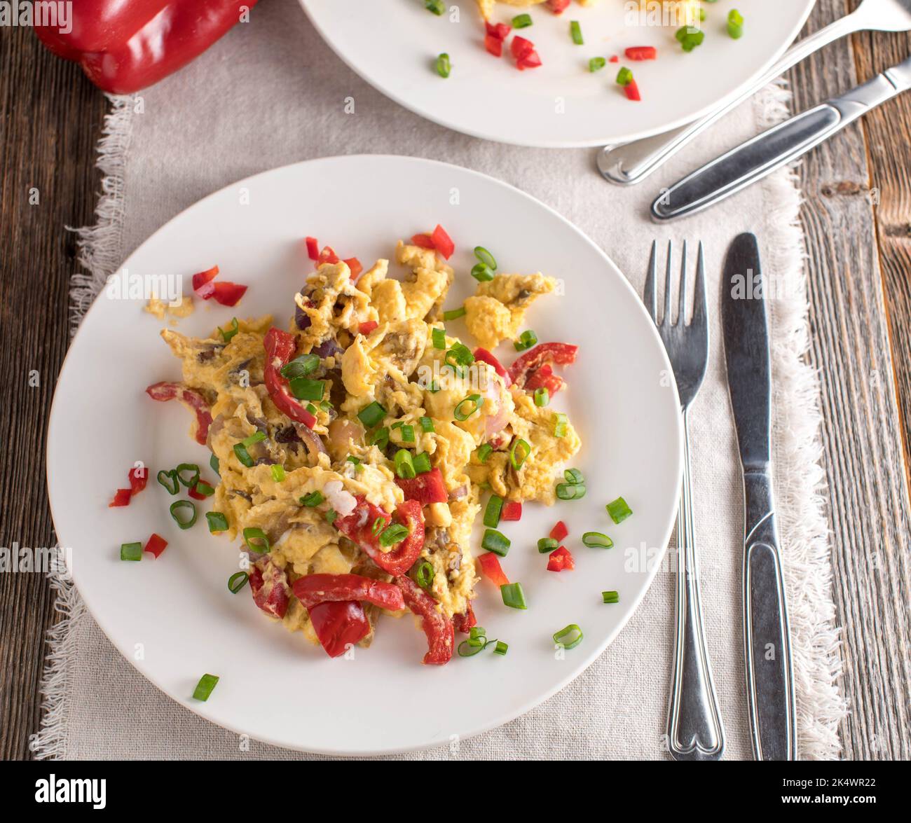 Scrambled eggs with vegetables on a plate Stock Photo