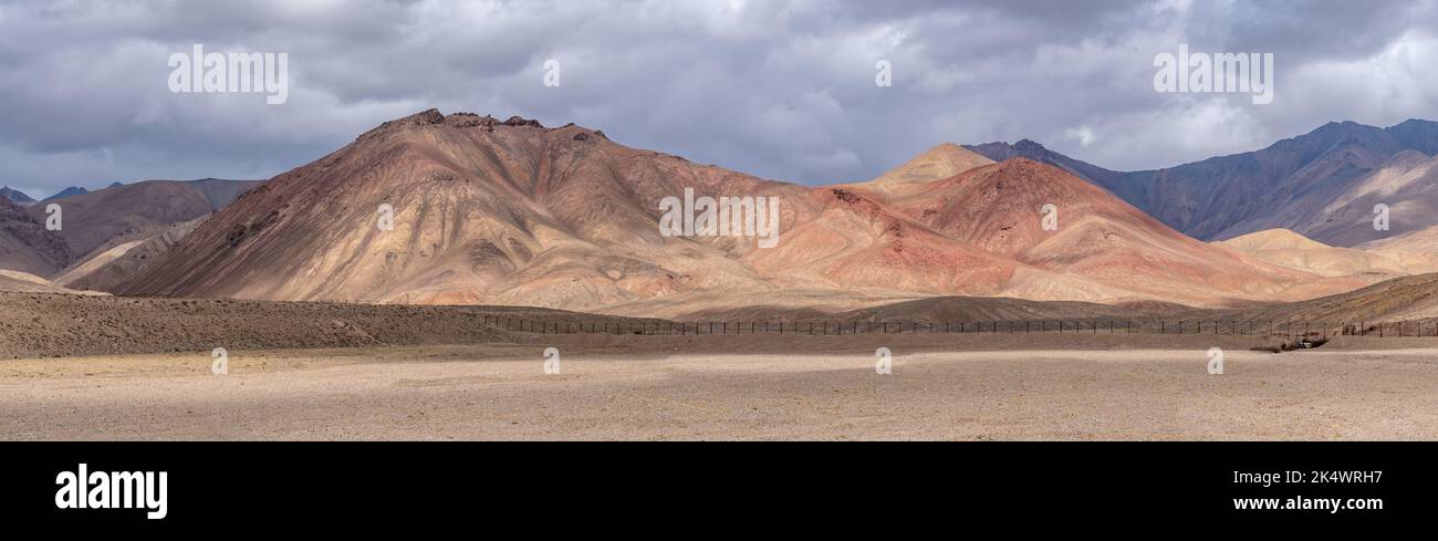Panoramic view of colorful high altitude desert on Pamir Highway between Murghab and Ak Baital pass, Gorno-Badakshan, Tajikistan along China border Stock Photo