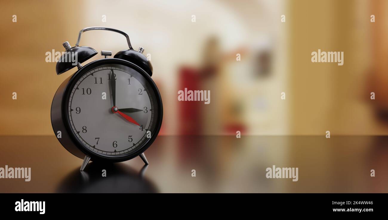 Fall Back Time. Daylight Saving End. Black alarm clock, one hour back