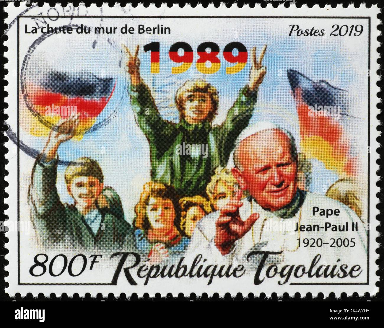 Pope John Paul II and the Berlin wall on stamp Stock Photo