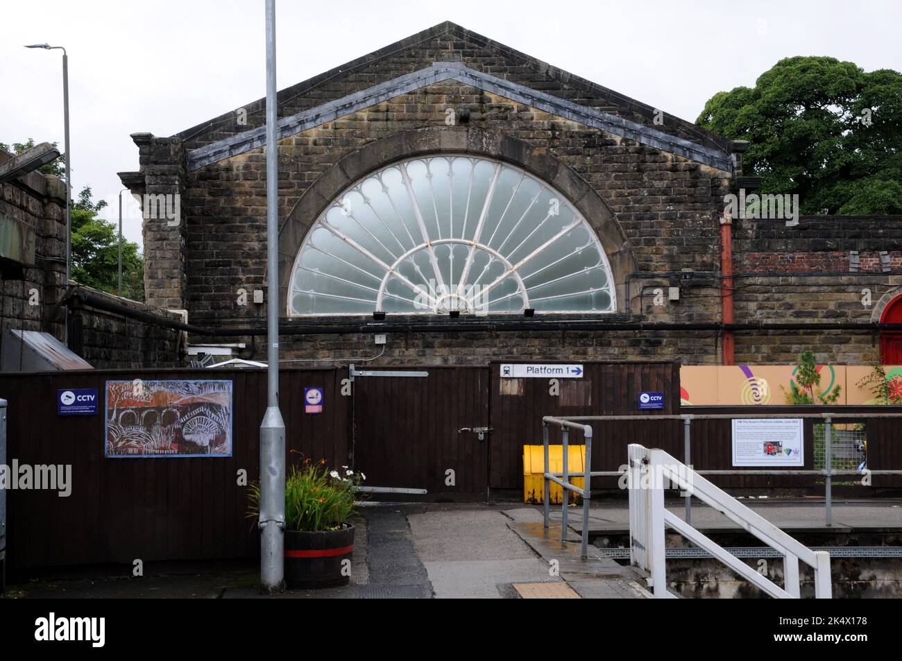 The remaining one of a pair of fan glass window at Buxton Station in the Derbyshire Peak District viewed from the platform. The window dates from 1863 Stock Photo