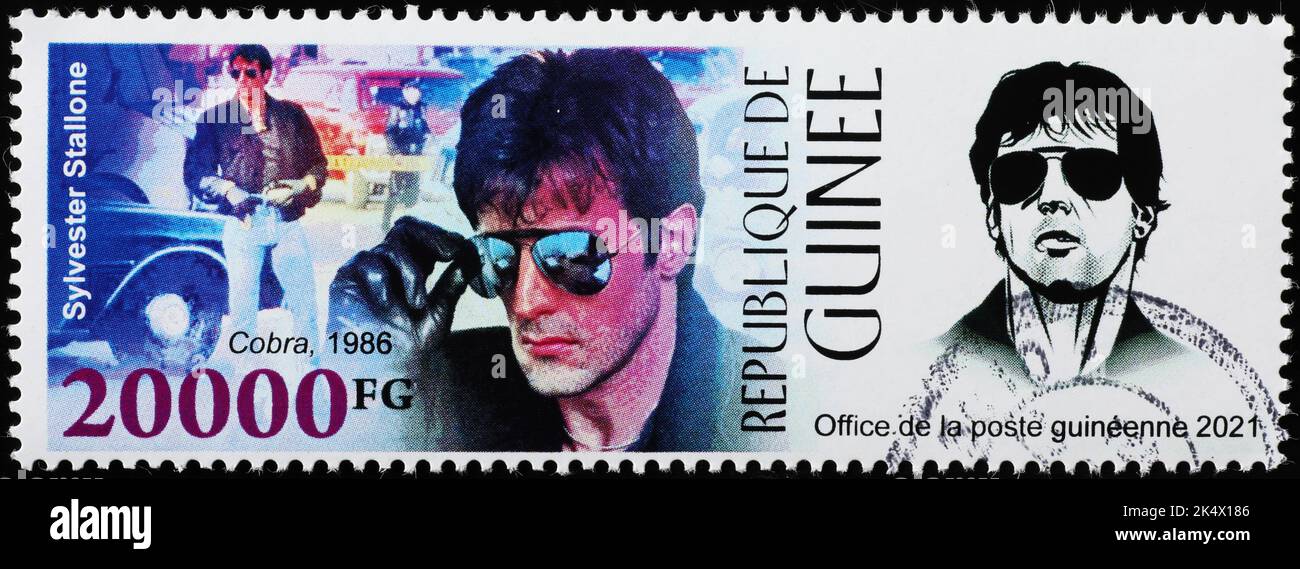 Sylvester Stallone in movie 'Cobra' on postage stamp Stock Photo