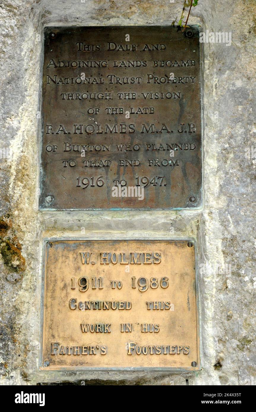 Two small easilly missed plaques in Dovedale commemorate the work done by RA Holmes and his son to acquire the dale for the National Trust. Stock Photo