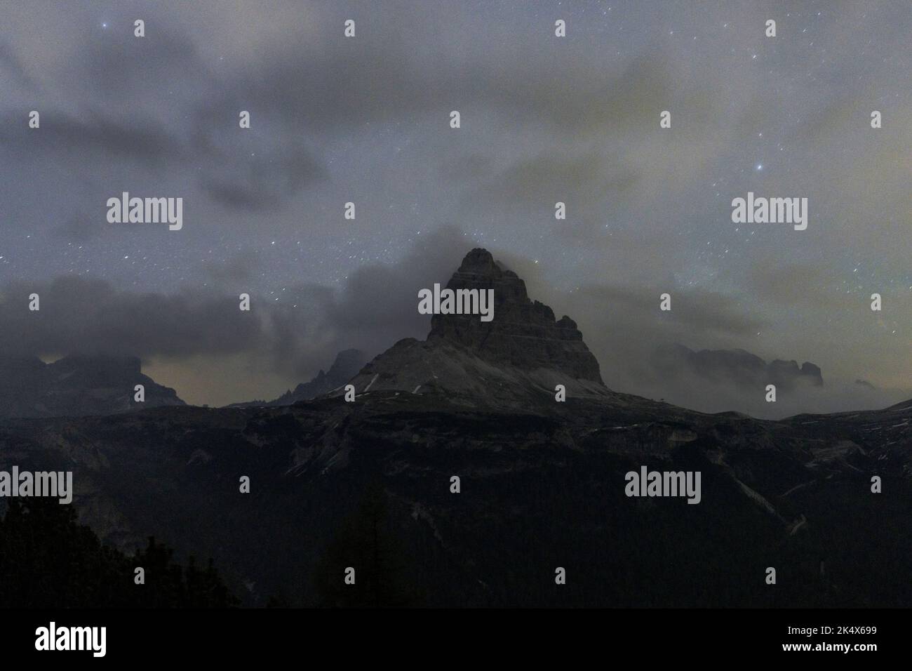 Starry night sky over Tre Cime di Lavaredo, Dolomites, South Tyrol, Italy Stock Photo