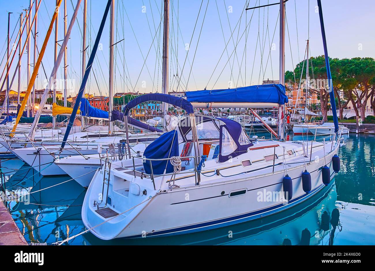 The sail yachts, moored at the shipyard of the Port of Desenzano del Garda, Lake Garda, Italy Stock Photo