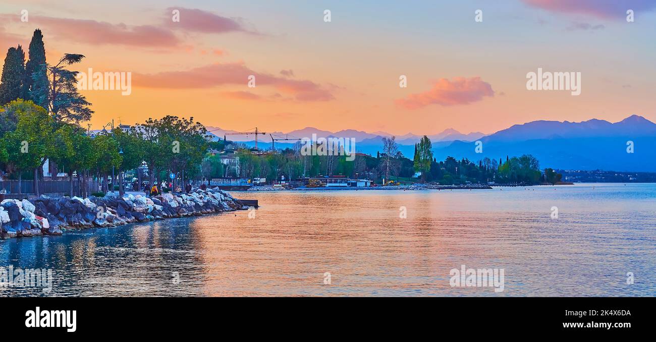 The sunset walk along the bank of Lake Garda, Desenzano del Garda, Italy Stock Photo
