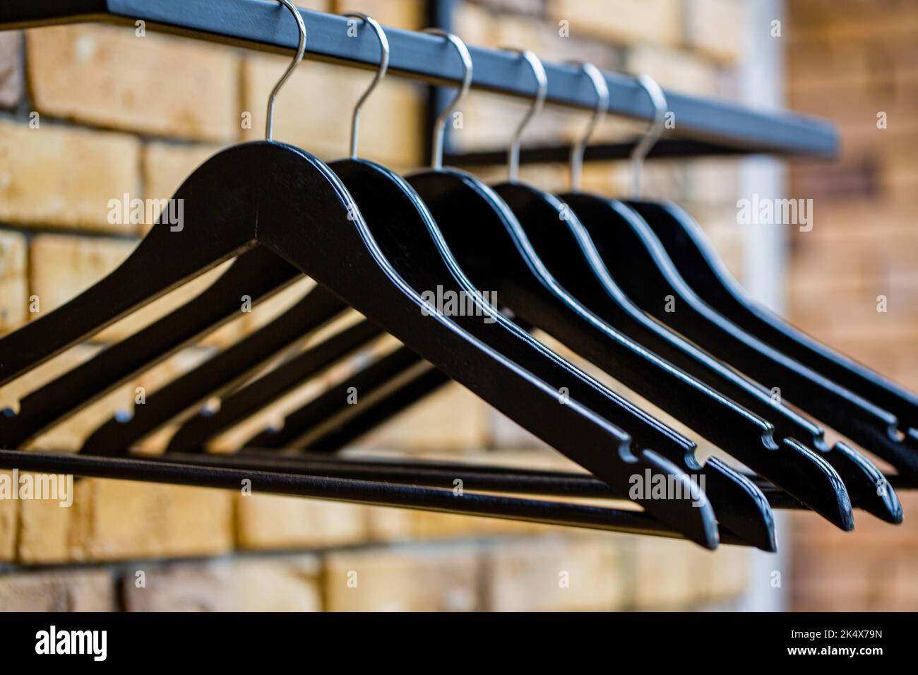 Store concept, sale, design, empty hangers. Wooden coat hanger clothes