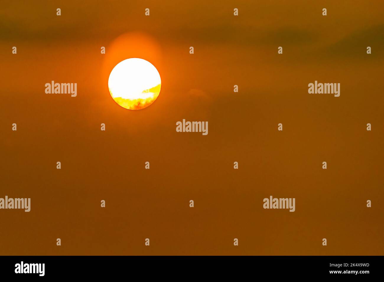 A Sun rising in the sky Stock Photo - Alamy