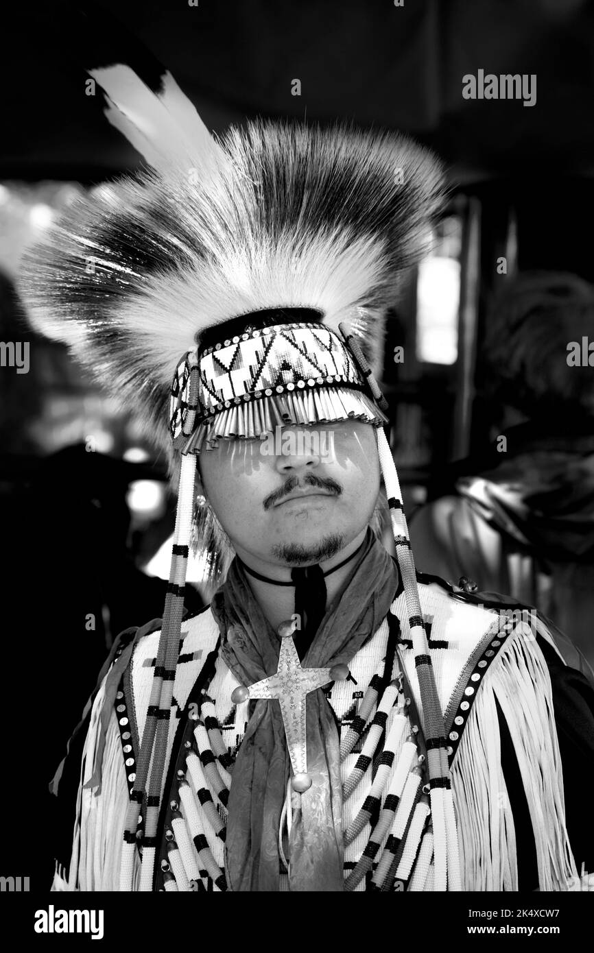 A Native American man, Trae Little Sky, poses for photographs at the annual Santa Fe Indian Market in Santa Fe, New Mexico. Stock Photo