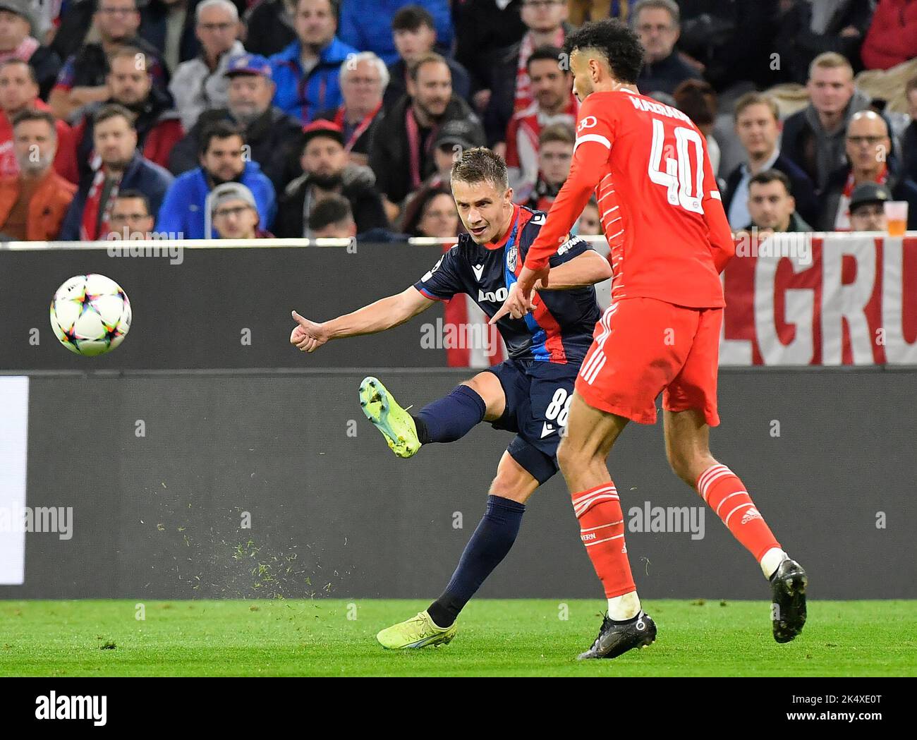 Munich, Germany. 04th Oct, 2022. Adam Vlkanova of Plzen, left, and Noussair Mazravi of Bayern in action during the Champions League, 3rd round, Group C match Bayern Munich vs Viktoria Plzen in Munich, Germany, October 4, 2022. Credit: Miroslav Chaloupka/CTK Photo/Alamy Live News Stock Photo