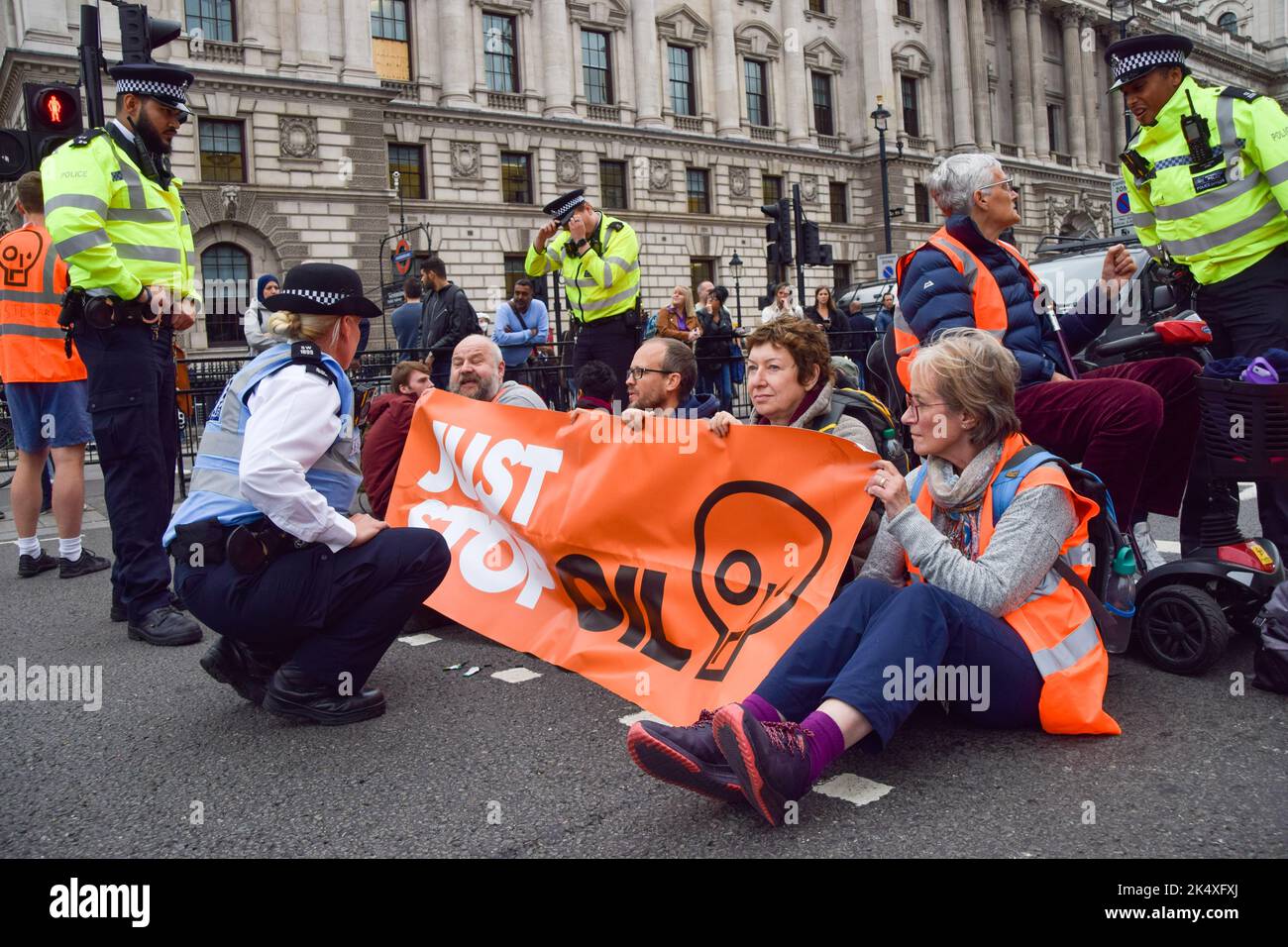 London, UK. 4th October 2022. Just Stop Oil protesters block the