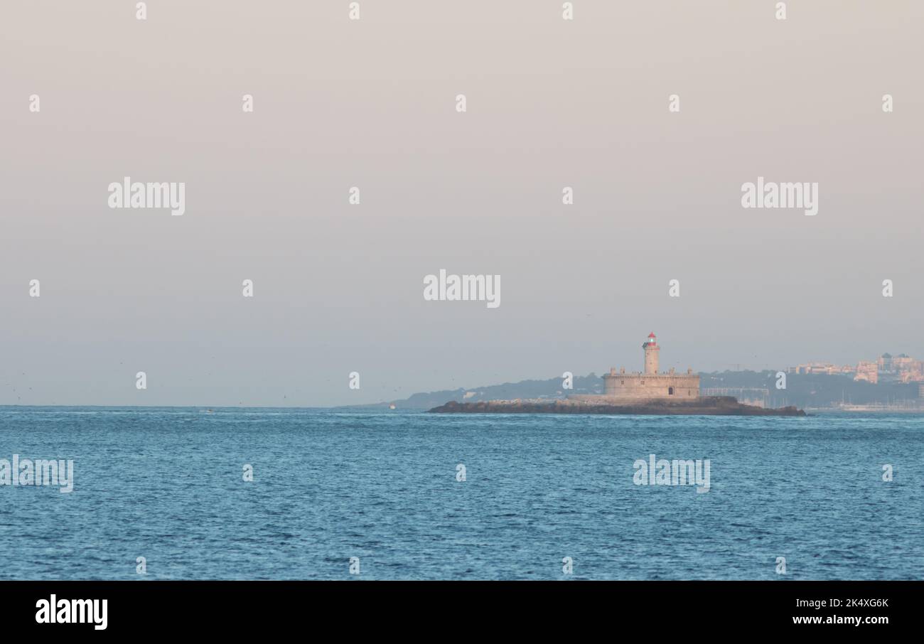 lighthouse at sunrise - coast of Portugal, island on the ocean Stock Photo