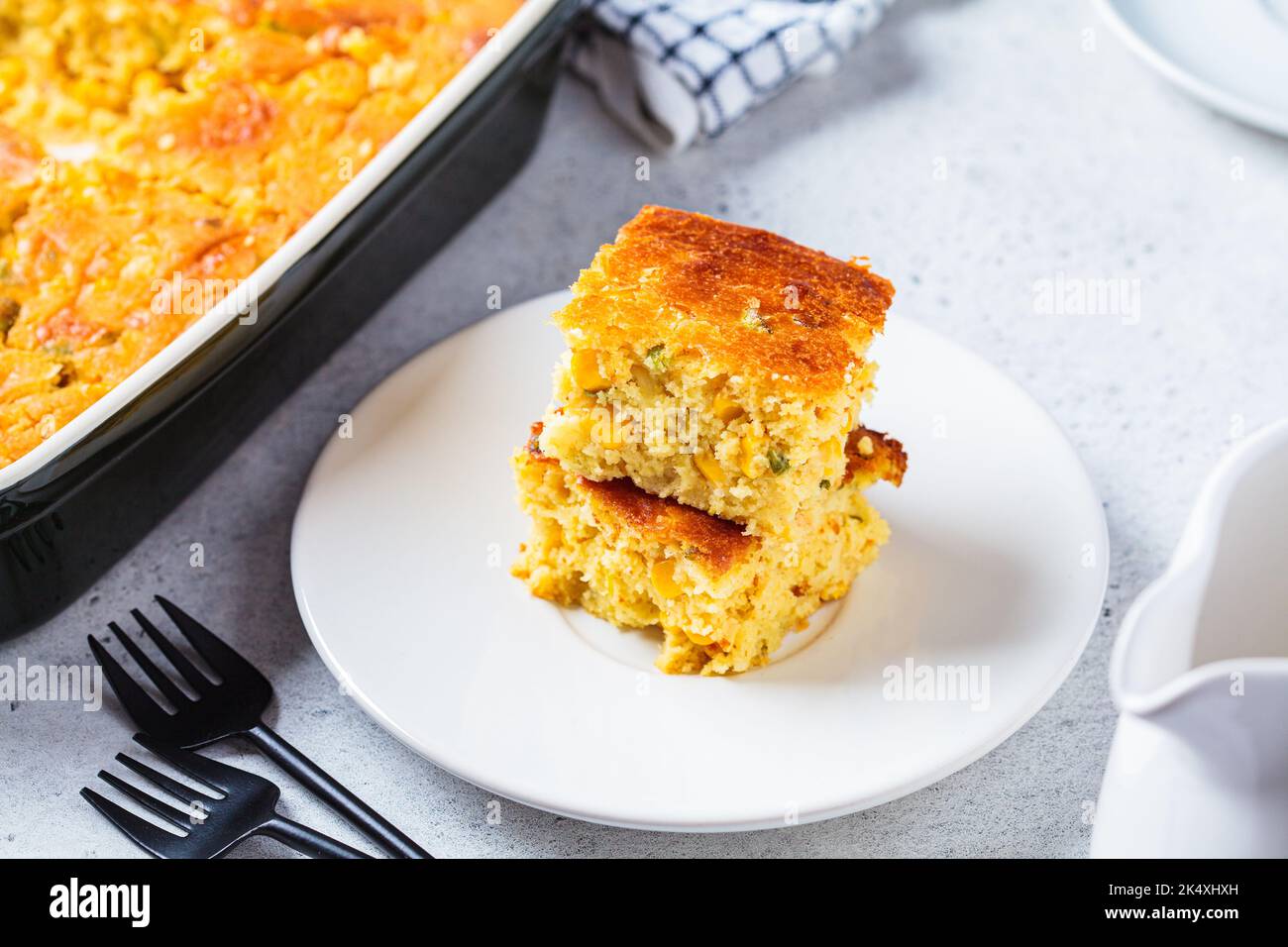 Old, rusty, cast-iron pan for baking cornbread sticks in the shape of corn  on the cob isolated against a white background Stock Photo - Alamy