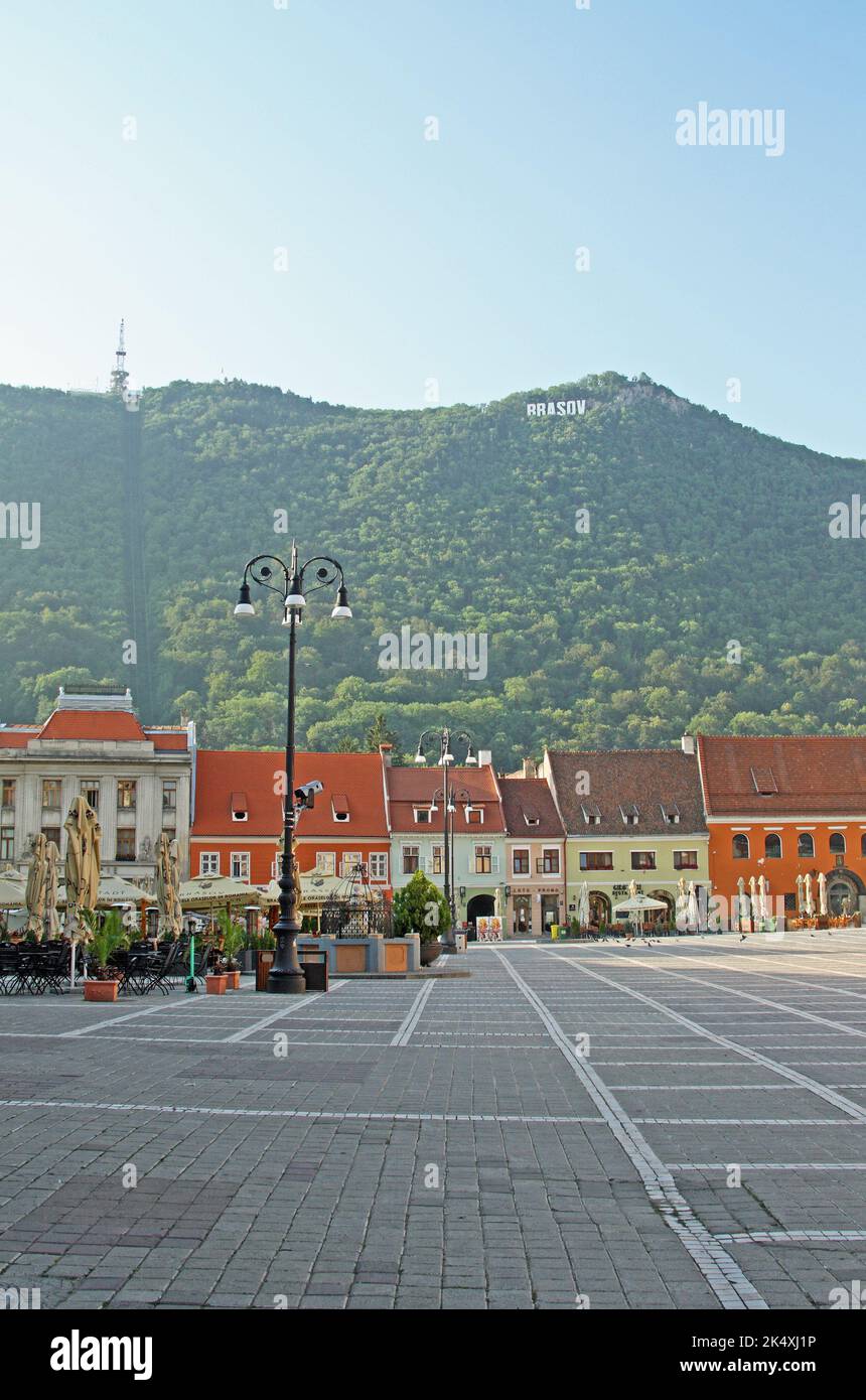 View of the Brasov sign on Tampa Mountain, from the Council Square (Piata Sfatului), Brasov, Transylvania, Romania. Stock Photo