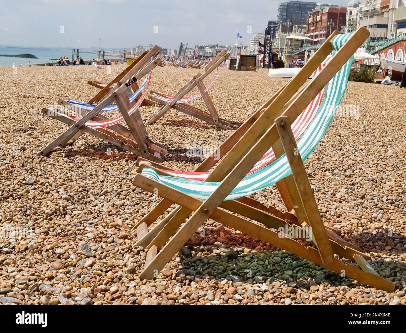 Folding deck chairs striped red and green with white stripes on