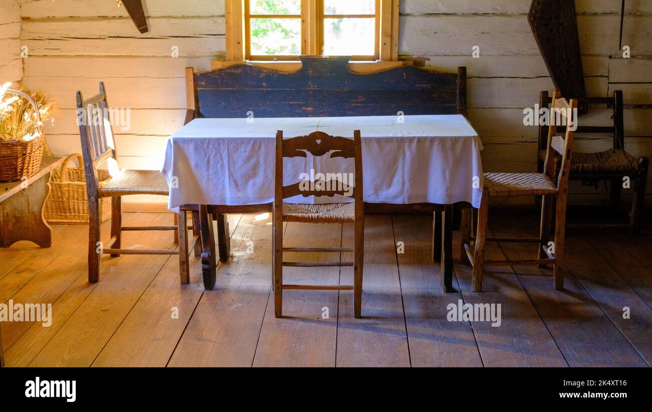 very old living room interior. minimal furniture, table, chairs Stock Photo Alamy