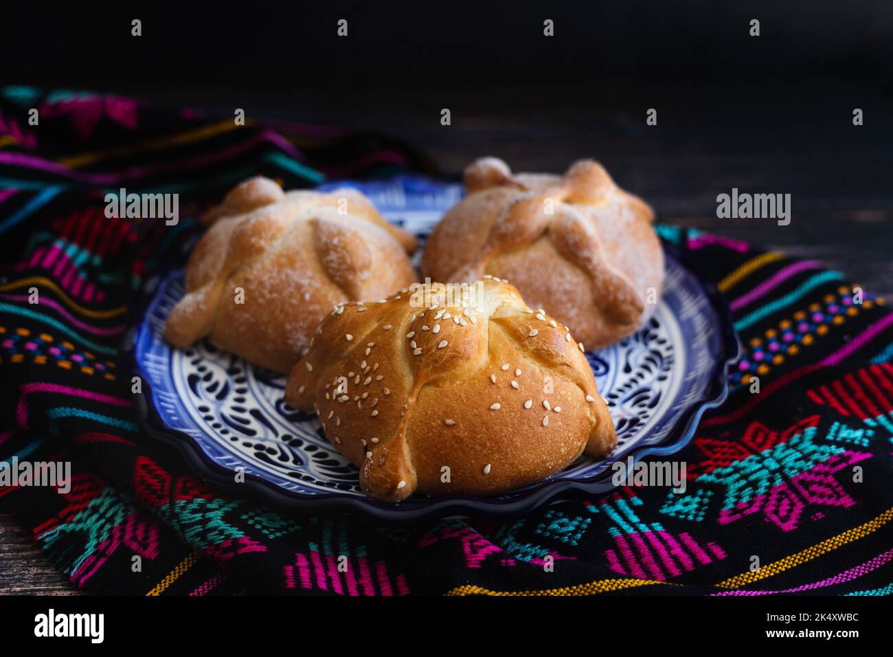 Mexican bread on Altar with sugar skull and hot chocolate traditional food for Celebration of Mexico's Day of the Dead Stock Photo
