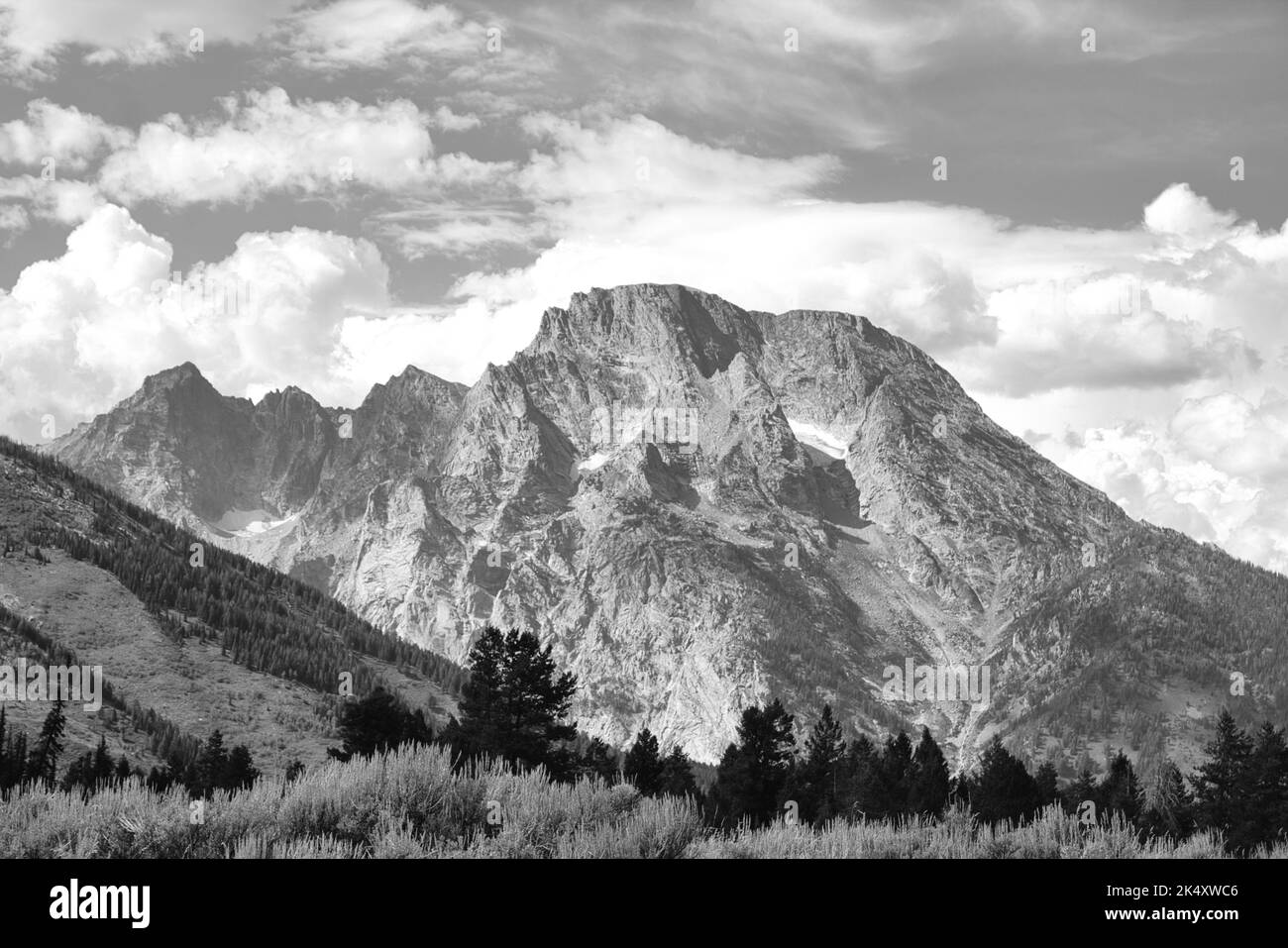 Monochromatic landscape photo of Mount Moran in Grand Teton National Park. Taken from the Cascade Canyon Turnout. Stock Photo
