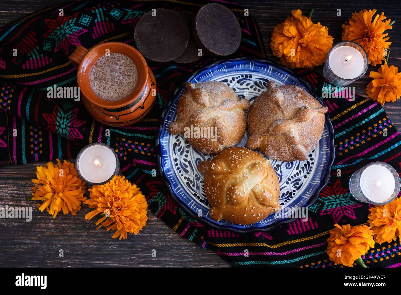 Mexican bread on Altar with sugar skull and hot chocolate traditional food for Celebration of Mexico's Day of the Dead Stock Photo