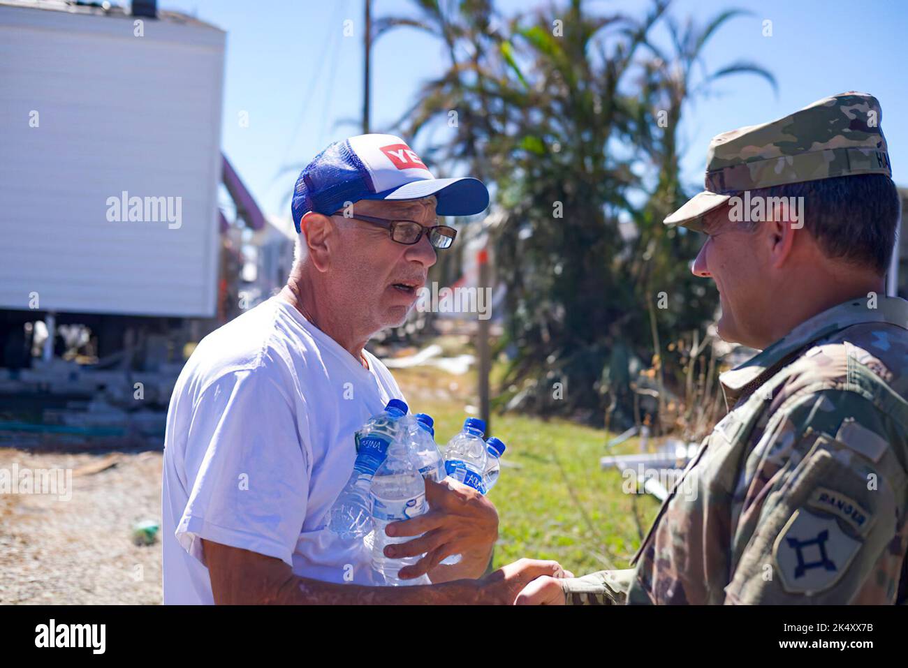 Florida Army National Guard Assistant Adjutant General, Maj. Gen. John Haas, conducts an on ground reconnaissance to evaluate the situation and current status of Pine Island, Florida in the aftermath of Hurricane Ian, Oct. 3, 2022. He listened to our fellow Floridians and local residents and reassured them help is on the way. Stock Photo