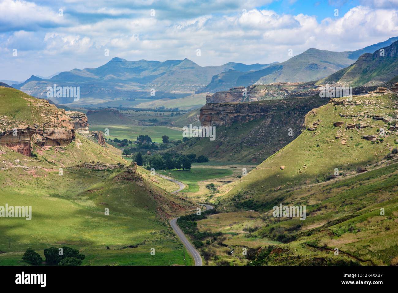 Looking down on a road winding through the valley in Golden Gate Highlands National Park. Viewed from the top of the Brandwag Buttress (Sentinel) rock Stock Photo