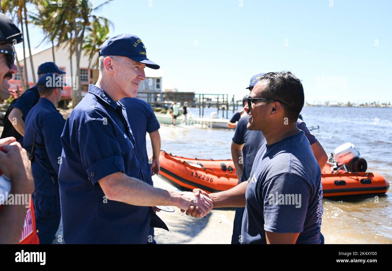 Vice Adm. Kevin E. Lunday, commander, Atlantic Area, speaks with Coast Guard personnel assigned to the Gulf, Atlantic and Pacific Strike teams in Matlacha Isles, Florida, Oct. 2, 2022. Lunday visited members who responded in the wake of Hurricane Ian. U.S. Coast Guard photo by Petty Officer 3rd Class Ian Gray. Stock Photo