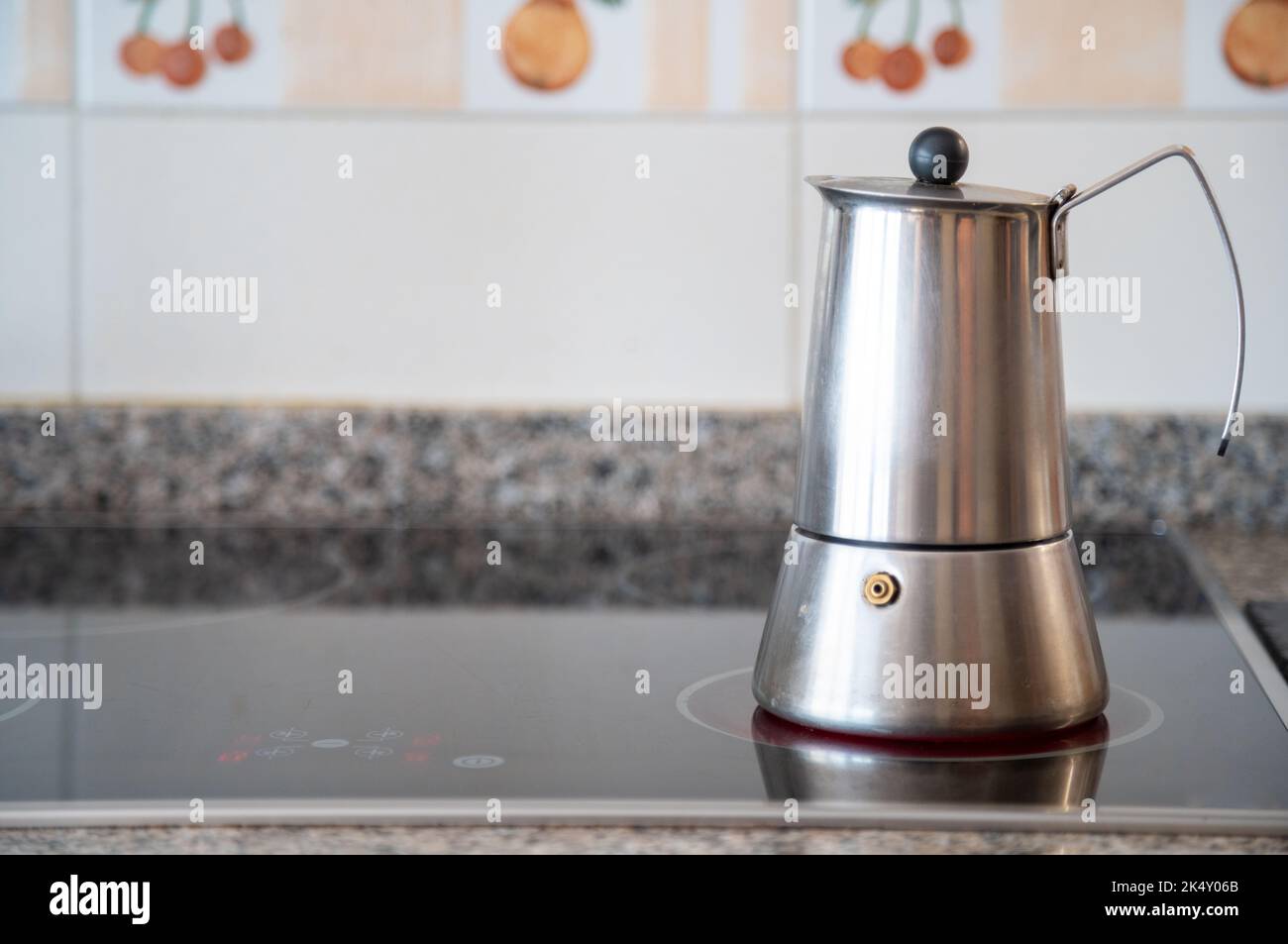 Italian coffee pot on a cooktop Stock Photo Alamy